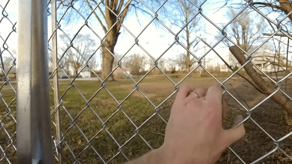 stretch a chain link fence